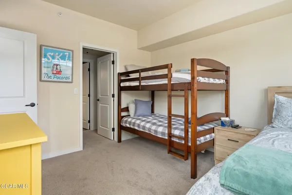 a bedroom with bed and window