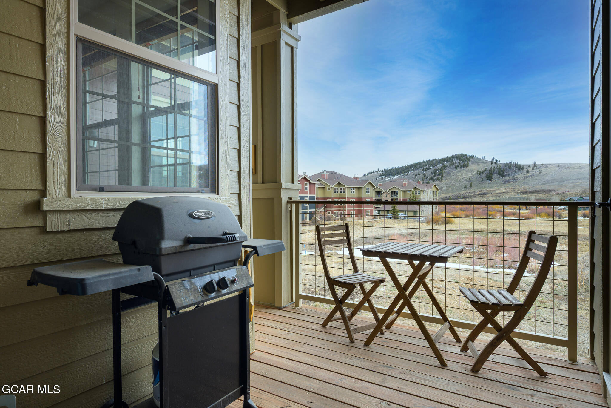 164 Village Road, Unit H203 Granby, CO 80446 - Photo 29 of 38 a view of a balcony with chairs and a table