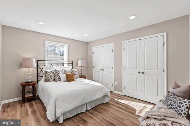 a bedroom with a bed and a mirror