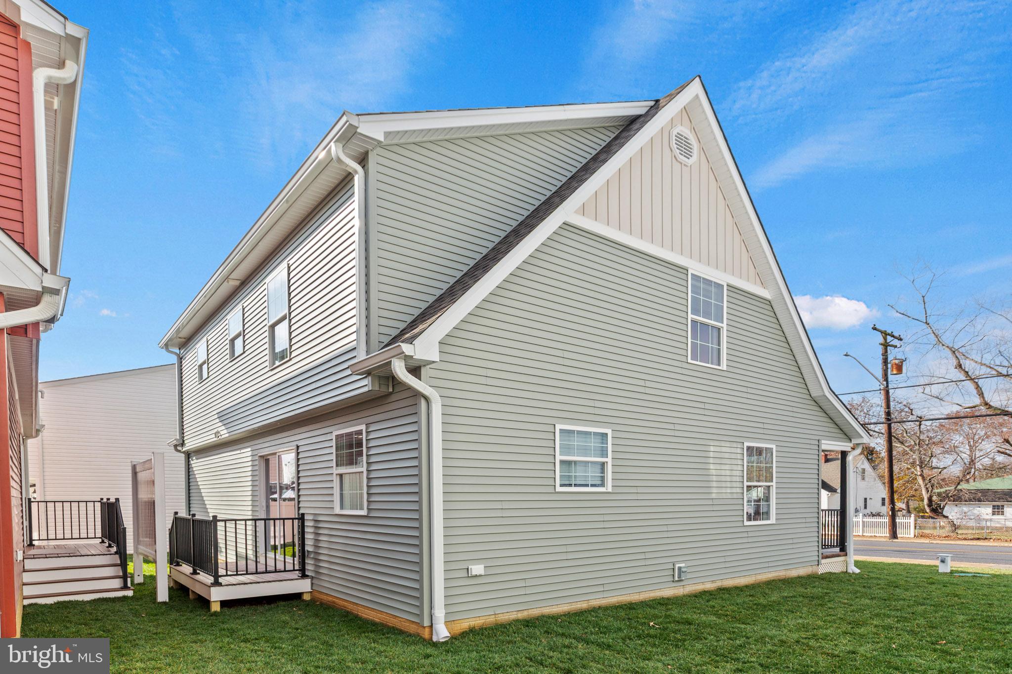 22802 Lawrence Avenue Leonardtown, MD 20650 - Photo 28 of 28 a view of backyard with a garden and deck