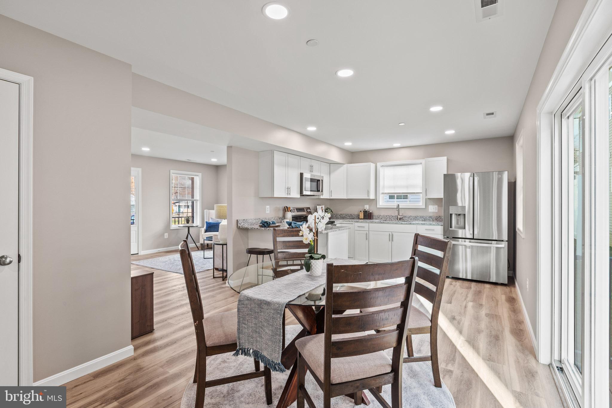 22802 Lawrence Avenue Leonardtown, MD 20650 - Photo 9 of 28 a view of a dining room with furniture and wooden floor