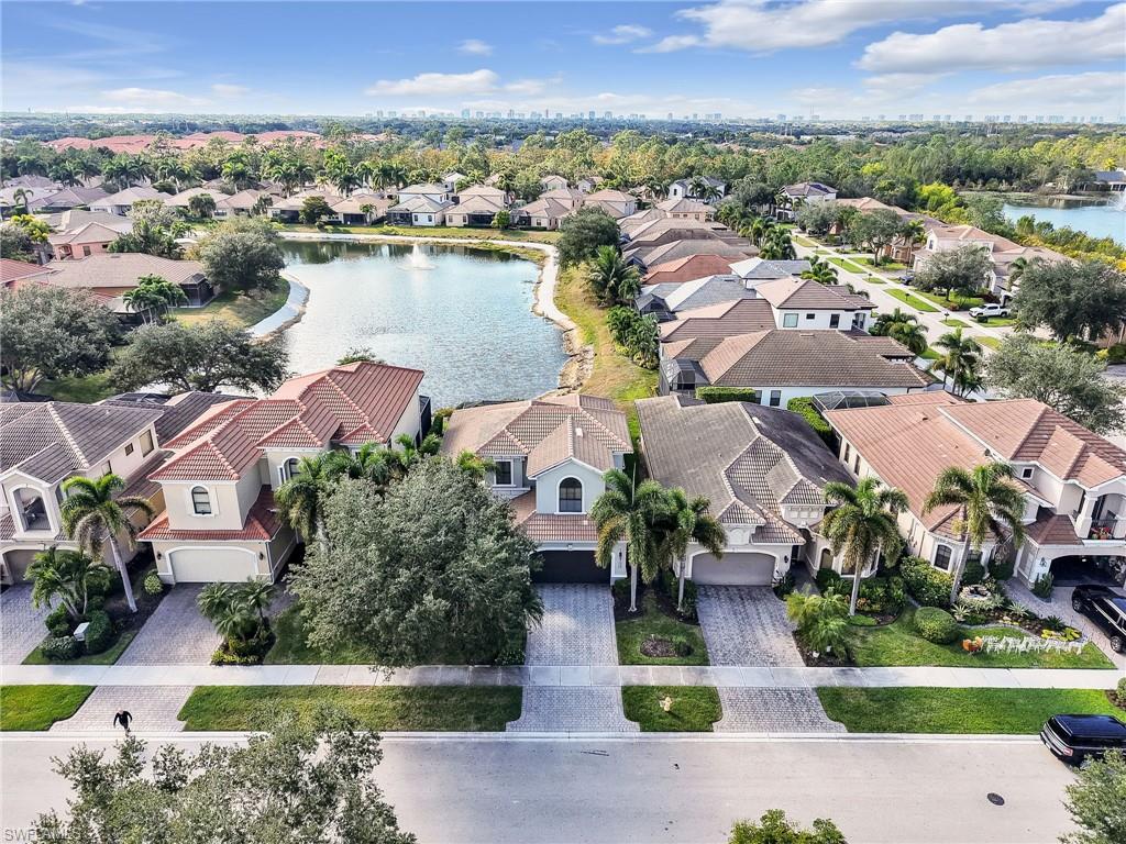 1365 Serrano Circle Naples, FL 34105 - Photo 1 of 46 Aerial view of residential area featuring a nearby body of water