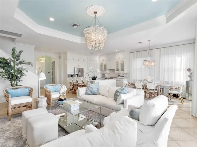 a living room with furniture or couches and a dining table with garden view