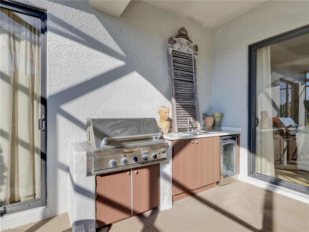 1365 Serrano Circle Naples, FL 34105 - Photo 23 of 46 View of patio with exterior kitchen and wine cooler