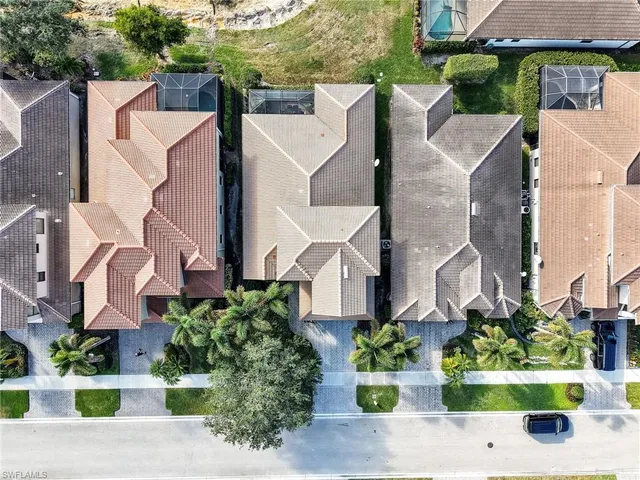 an aerial view of a house with a yard and a garden
