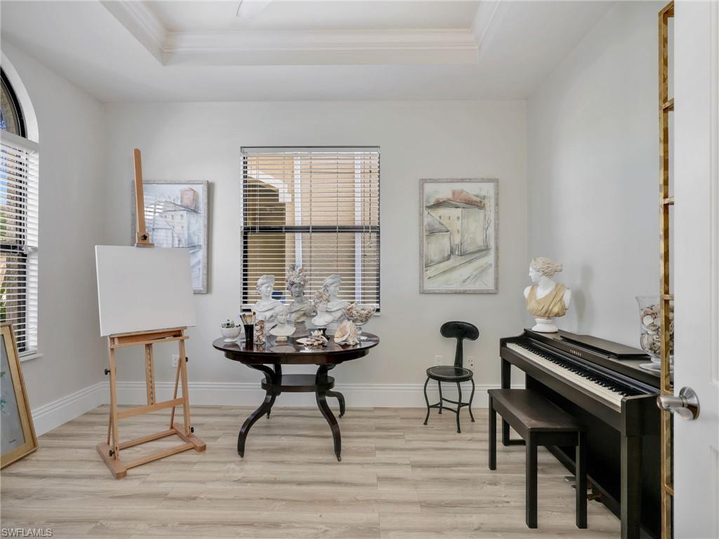 1365 Serrano Circle Naples, FL 34105 - Photo 34 of 46 Sitting room with a raised ceiling, light wood-type flooring, and crown molding