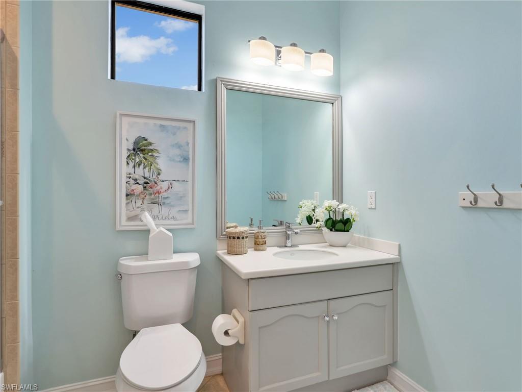 1365 Serrano Circle Naples, FL 34105 - Photo 38 of 46 Full bath featuring vanity and a tile shower