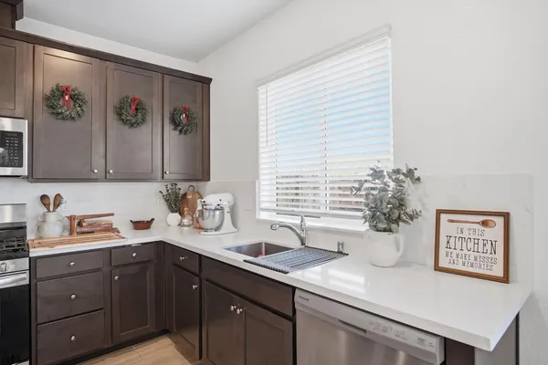 a kitchen with a sink and a refrigerator