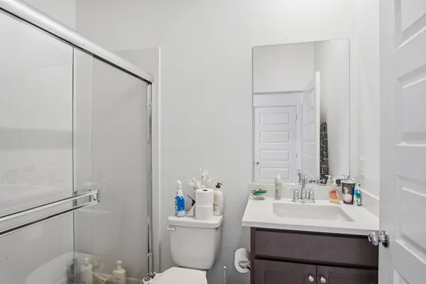 a bathroom with a sink toilet and vanity