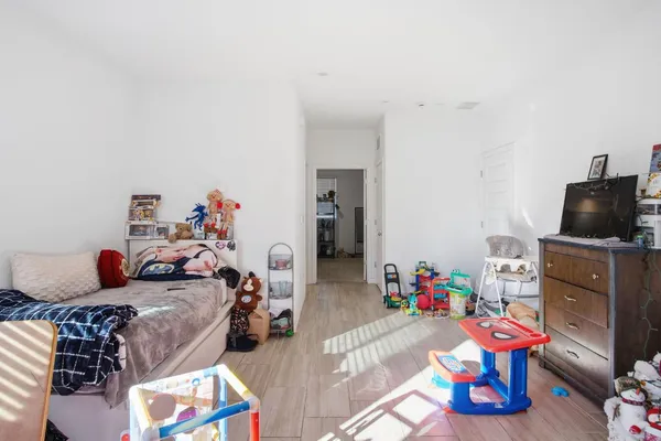 a room with furniture and a flat screen tv