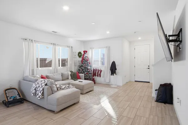 a living room with furniture and a window