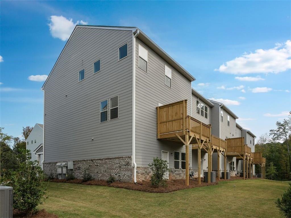 1701 Lansmere Street Southwest Marietta, GA 30008 - Photo 19 of 29 a view of a house with a yard
