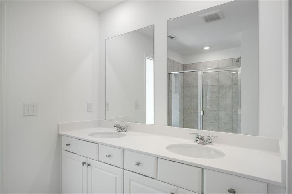 1701 Lansmere Street Southwest Marietta, GA 30008 - Photo 4 of 29 a bathroom with a sink and a mirror