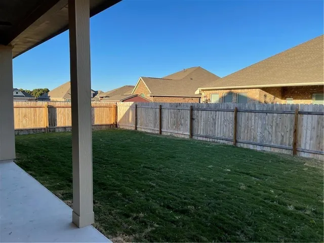 a view of a yard with an outdoor space