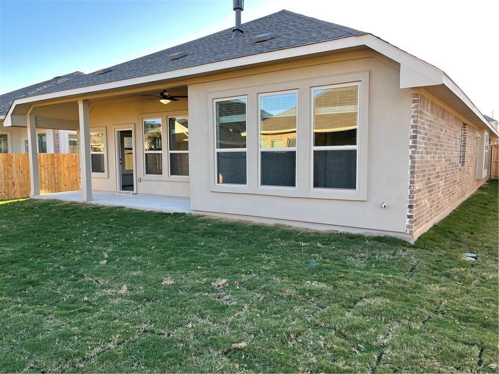208 Baralo Street Leander, TX 78641 - Photo 22 of 23 a view of a house with a backyard