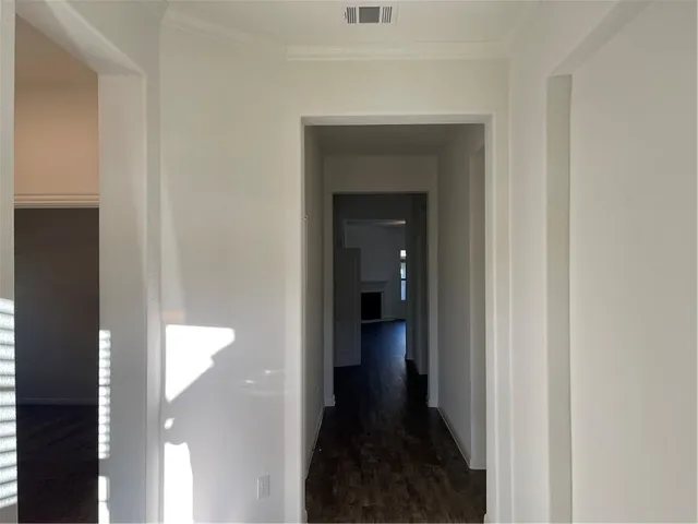 a view of a bathroom from a hallway