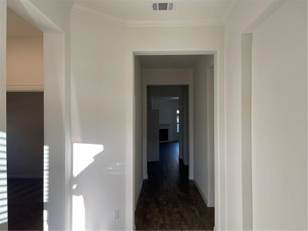 208 Baralo Street Leander, TX 78641 - Photo 3 of 23 a view of a bathroom from a hallway