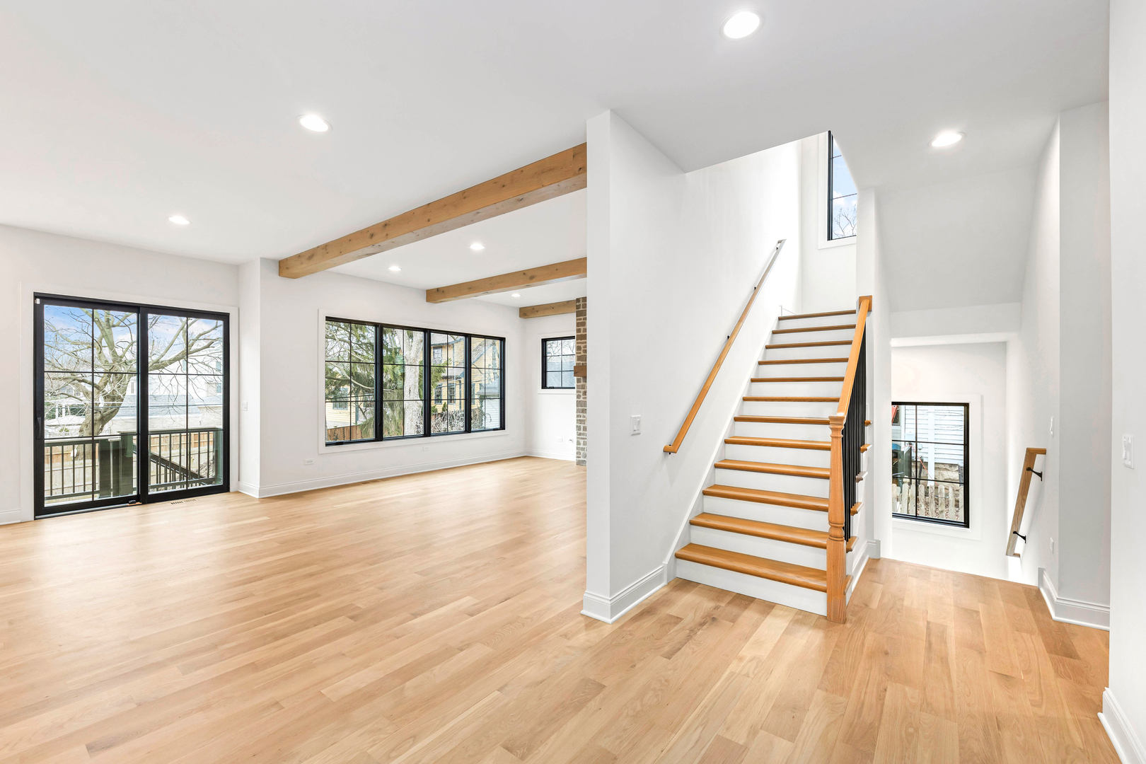 660 Eagle Street Naperville, IL 60563 - Photo 21 of 45 an empty room with wooden floor and windows