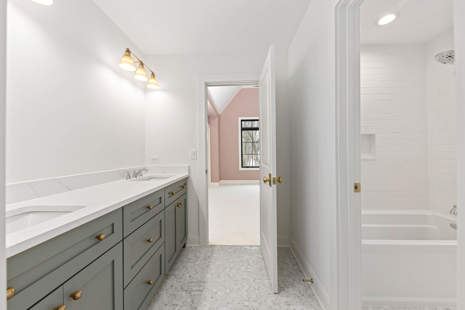 660 Eagle Street Naperville, IL 60563 - Photo 33 of 45 a bathroom with a sink a mirror and a bathtub