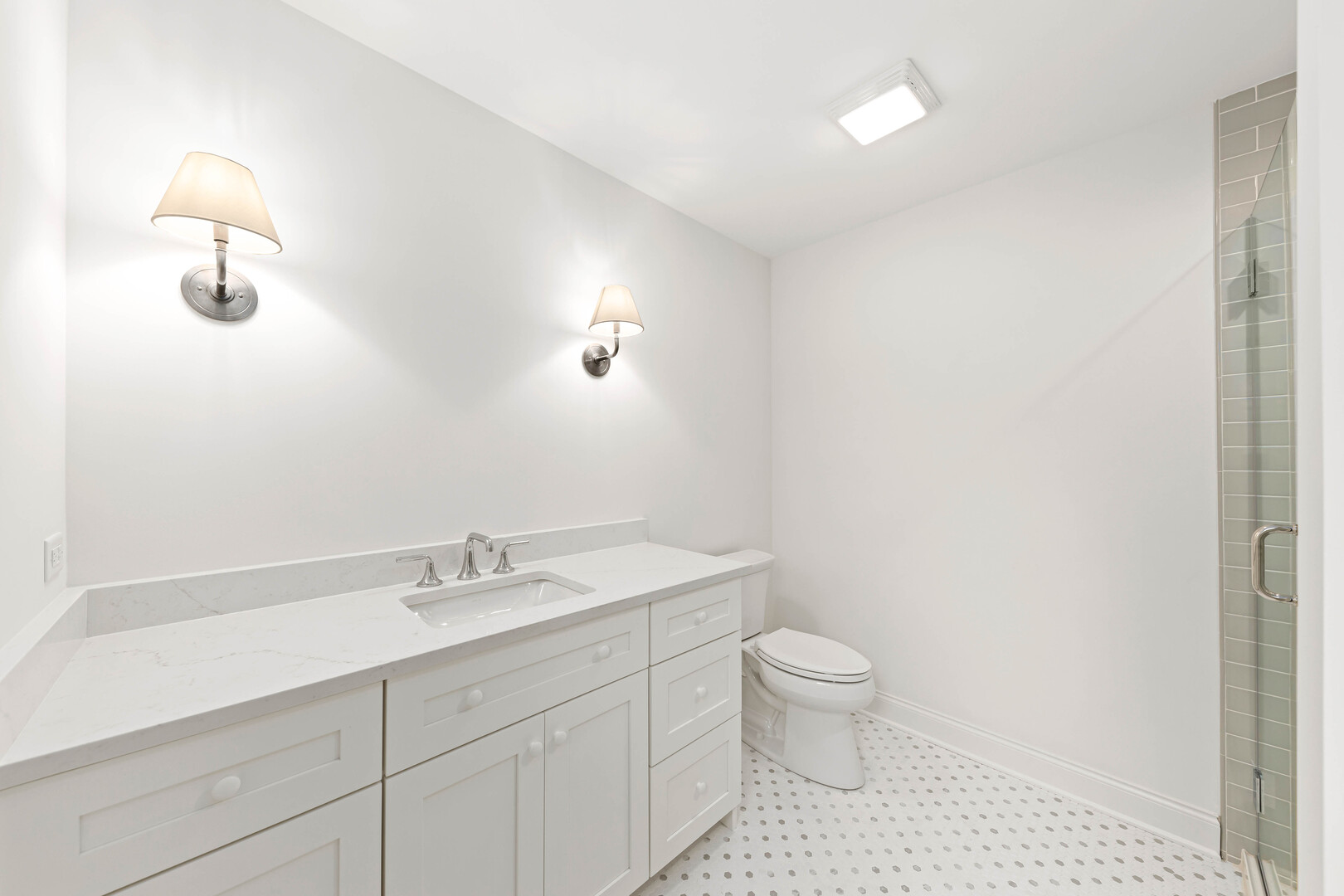 660 Eagle Street Naperville, IL 60563 - Photo 40 of 45 a bathroom with a sink a toilet and a mirror