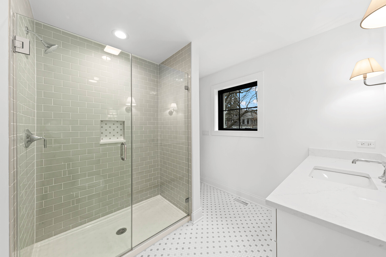 660 Eagle Street Naperville, IL 60563 - Photo 41 of 45 a bathroom with a shower sink and mirror