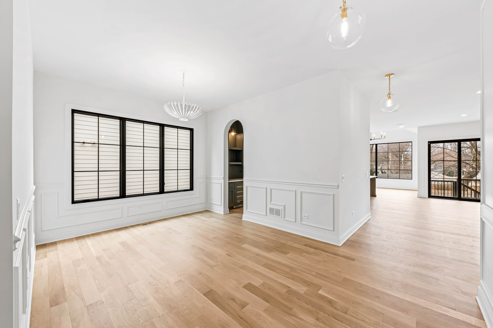 660 Eagle Street Naperville, IL 60563 - Photo 8 of 45 a view of an empty room with window and wooden floor