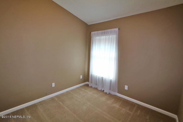 12935 Spring Rain Road Jacksonville, FL 32258 - Photo 15 of 28 an empty room with windows