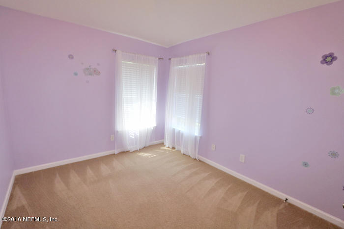 12935 Spring Rain Road Jacksonville, FL 32258 - Photo 16 of 28 a view of an empty room with a window