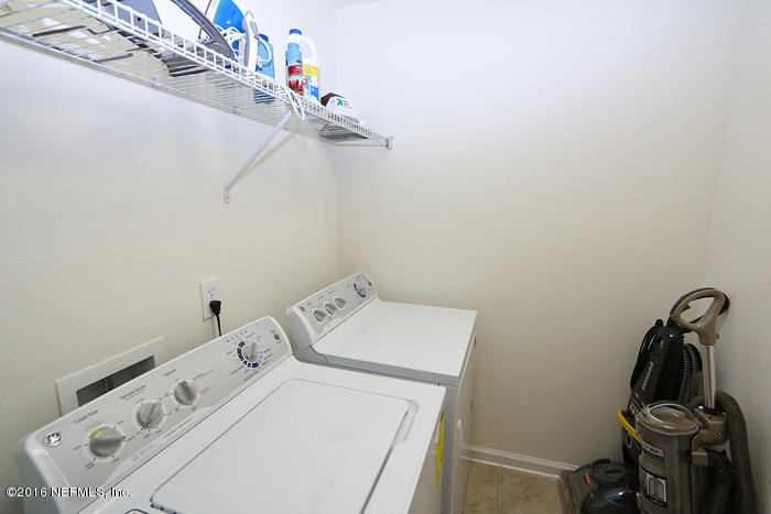 12935 Spring Rain Road Jacksonville, FL 32258 - Photo 19 of 28 a utility room with dryer and washer
