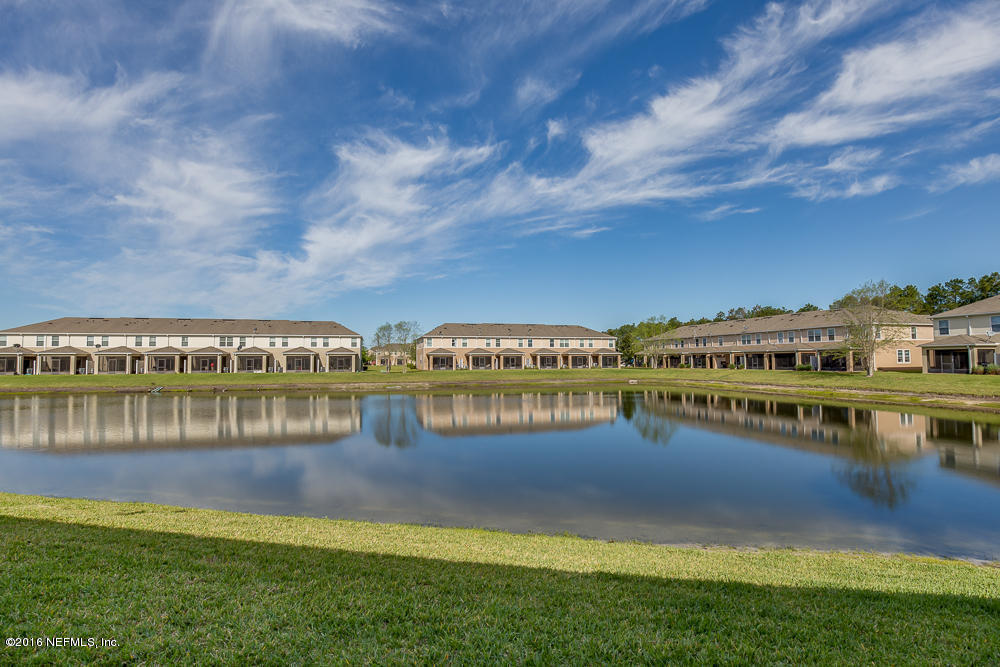 12935 Spring Rain Road Jacksonville, FL 32258 - Photo 26 of 28 a view of a lake with houses