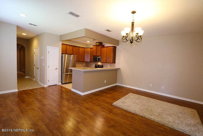 12935 Spring Rain Road Jacksonville, FL 32258 - Photo 6 of 28 a view of a kitchen with a sink and cabinet