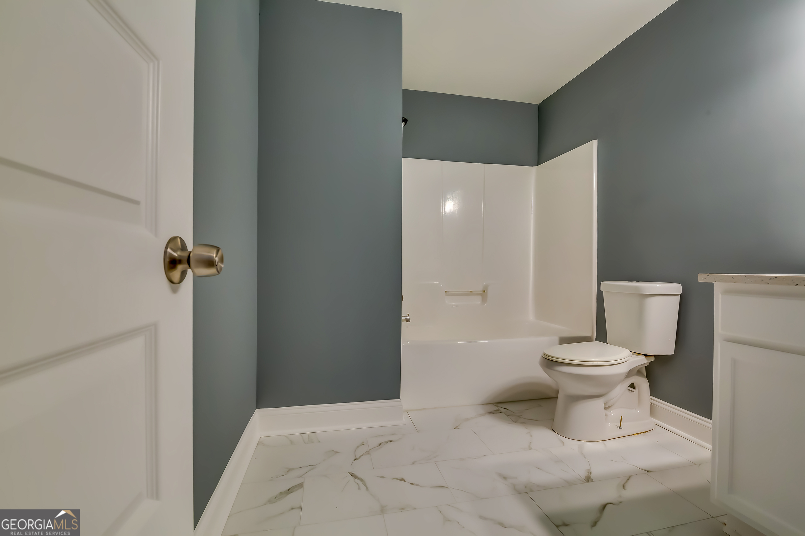 6269 Colonial View Fairburn, GA 30213 - Photo 13 of 13 a bathroom with a toilet and a shower