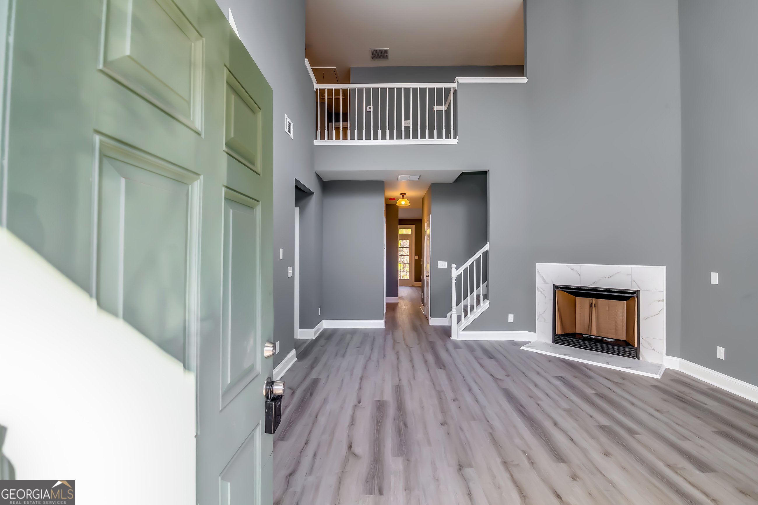 6269 Colonial View Fairburn, GA 30213 - Photo 3 of 13 a view of a livingroom with wooden floor and a staircase