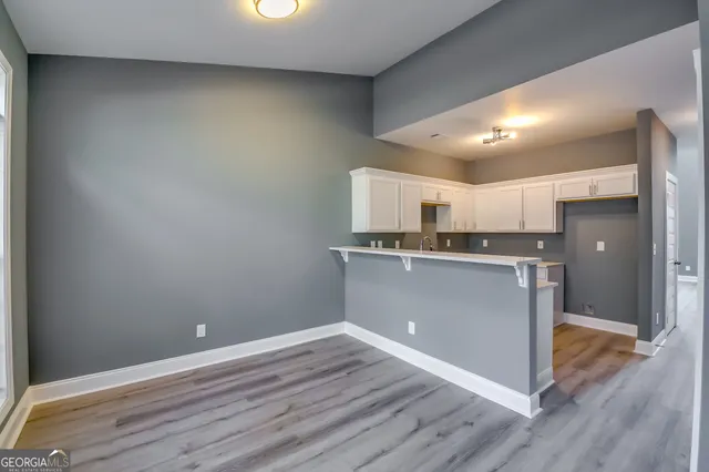 a view of kitchen with wooden floor