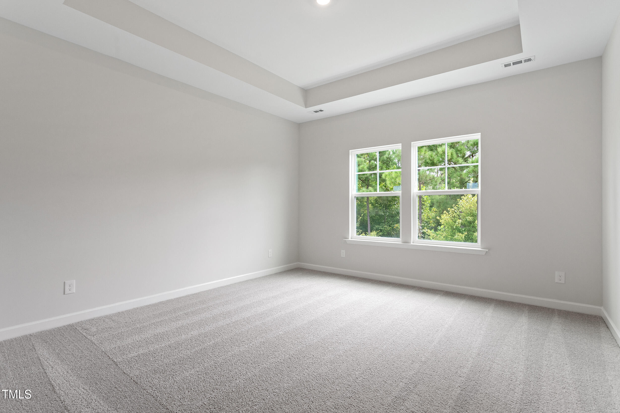 239 Meadowbark Bend, Unit 27 Garner, NC 27529 - Photo 15 of 36 an empty room with a window