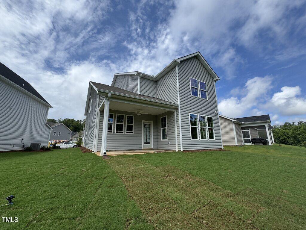 239 Meadowbark Bend, Unit 27 Garner, NC 27529 - Photo 24 of 36 a front view of a house with a yard