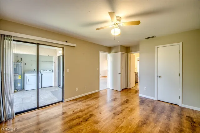 a view of an empty room with glass door
