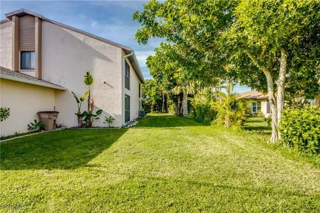 a view of a backyard of the house