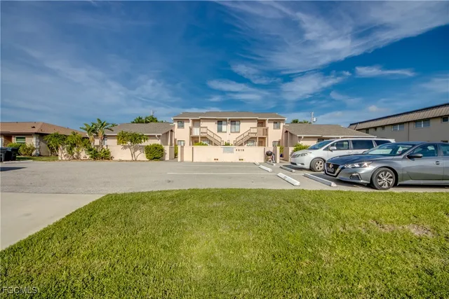 a view of a car parked in front of a building