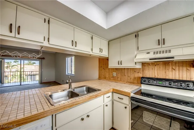 a kitchen with a sink and cabinets