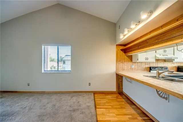 a kitchen with a sink and cabinets