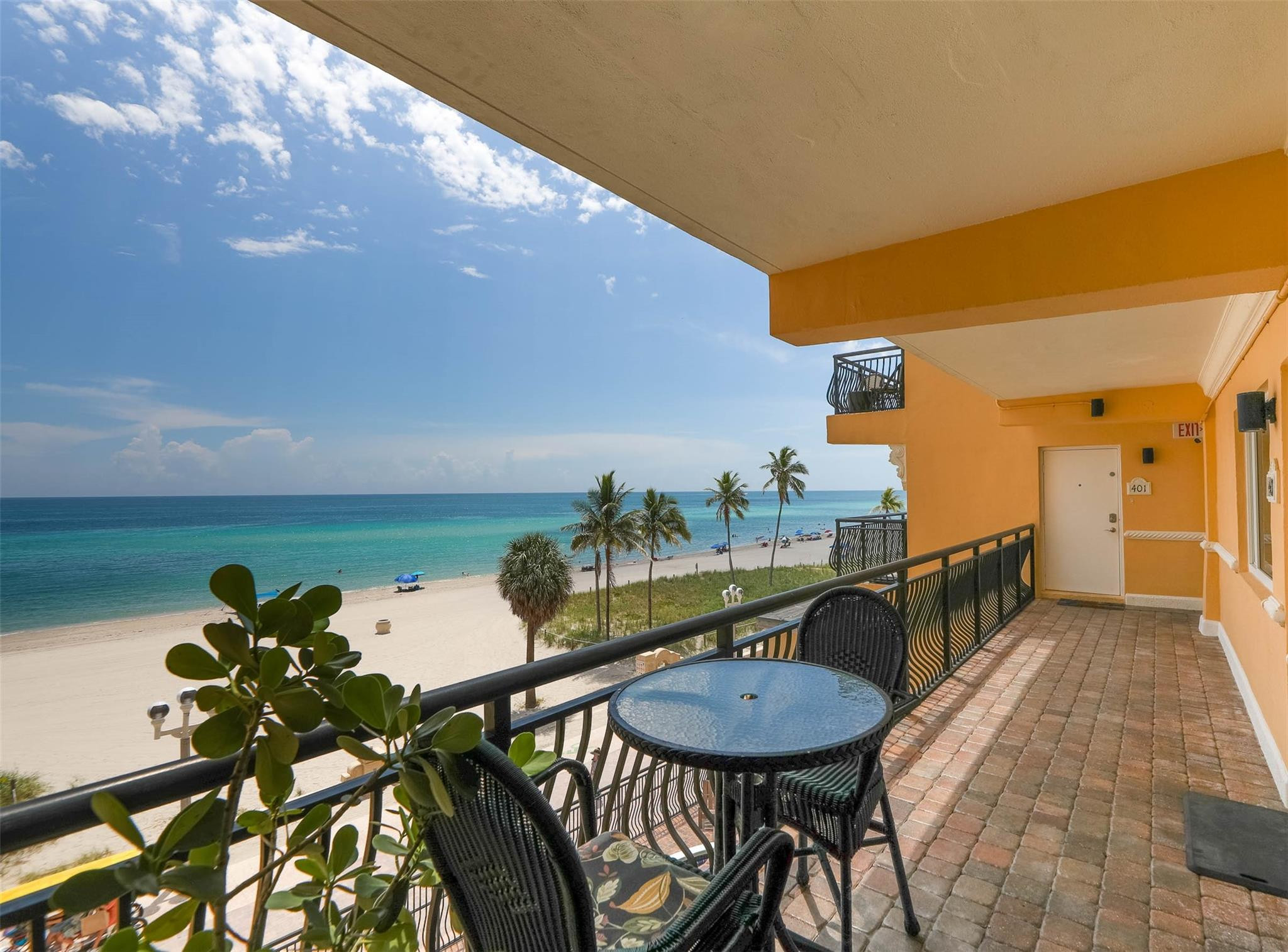 1815 North Surf Road, Unit 403 Hollywood, FL 33019 - Photo 15 of 28 a balcony with table and chairs
