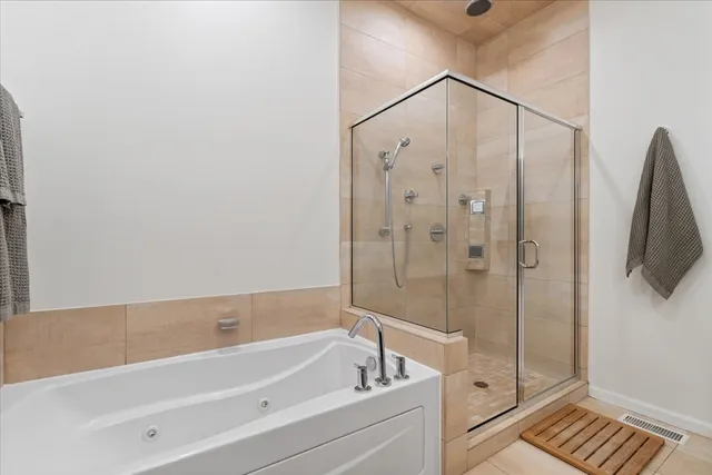 a bed room with a bed and a chair