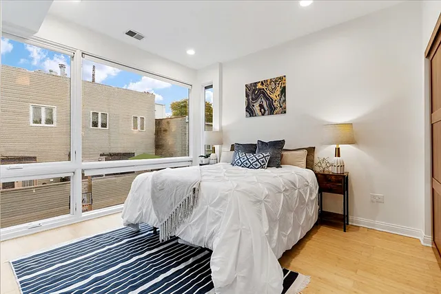 a bathroom with a double vanity sink toilet mirror and bathtub