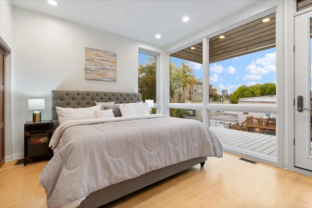 a bedroom with a bed and a large mirror