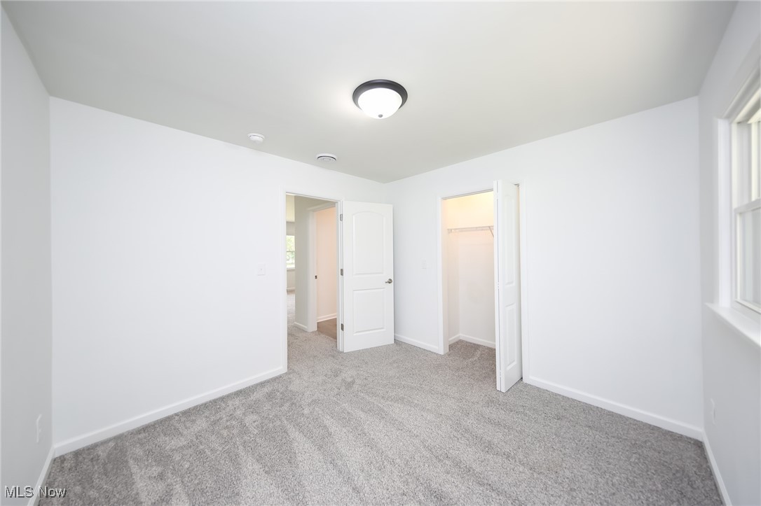 6544 Neff Road Valley City, OH 44280 - Photo 16 of 45 Unfurnished bedroom with light carpet and a closet
