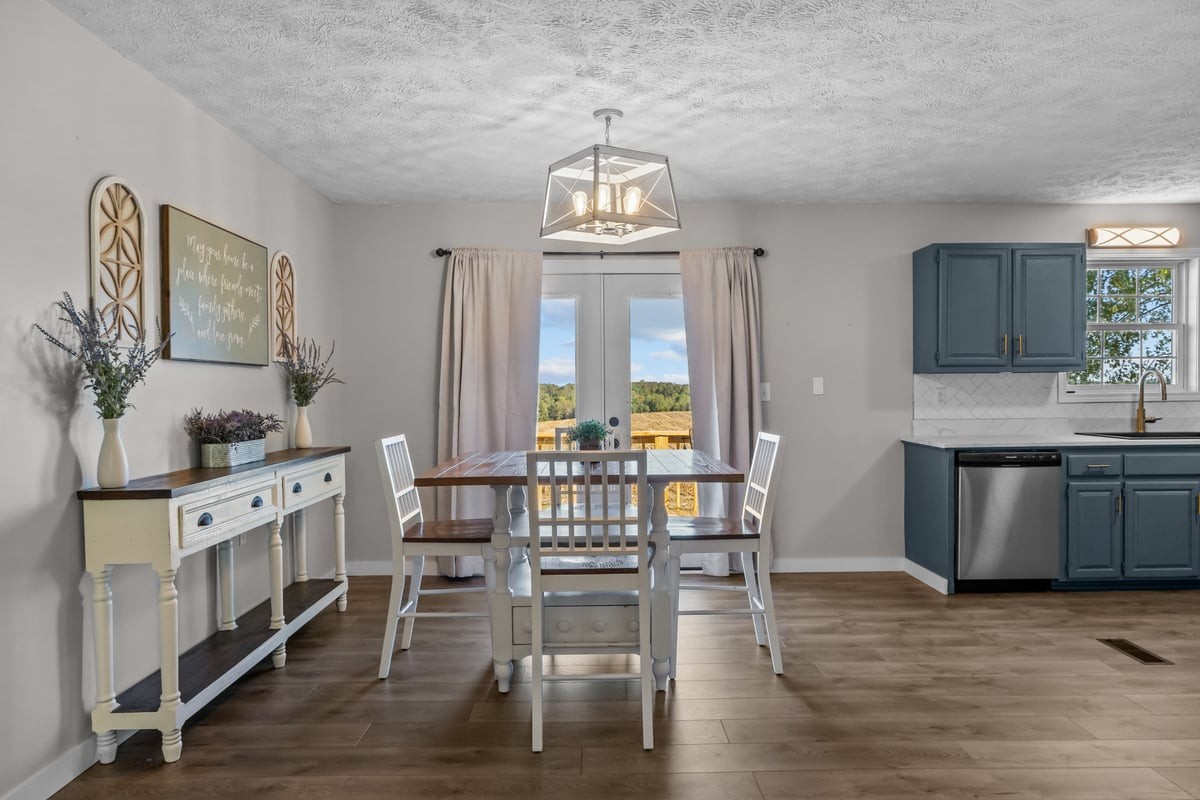 365 Little Benton Road Mansfield, TN 38236 - Photo 14 of 53 a view of a dining room with furniture window and wooden floor