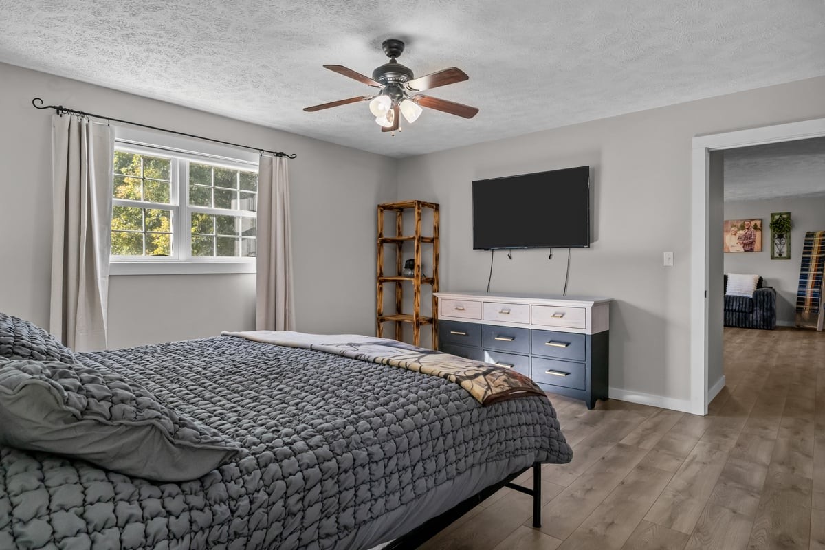 365 Little Benton Road Mansfield, TN 38236 - Photo 21 of 53 a bedroom with a bed and a flat screen tv