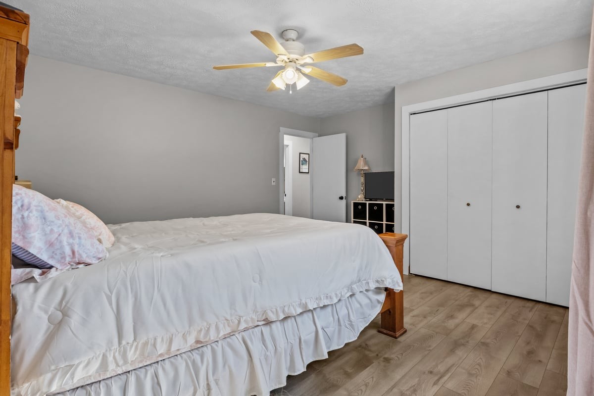 365 Little Benton Road Mansfield, TN 38236 - Photo 27 of 53 a bedroom with a bed and a ceiling fan