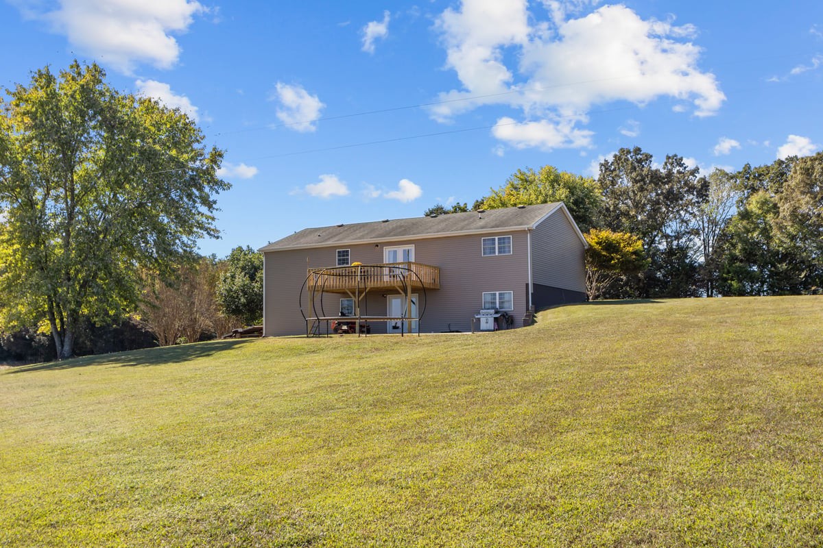 365 Little Benton Road Mansfield, TN 38236 - Photo 35 of 53 a view of a house with a yard and garage